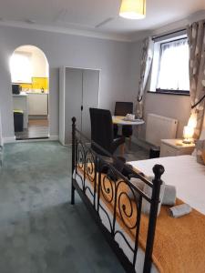 a bedroom with a bed and a living room at Eden House 1-bedroom, horses welcome. in Whitland