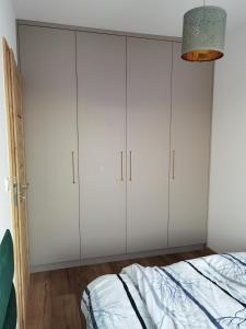 Posteľ alebo postele v izbe v ubytovaní Apartament Olecko Centrum