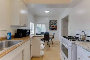 a kitchen with a sink and a stove top oven at 2 Bedroom Mid-Wilshire Charmer close to Downtown in Los Angeles