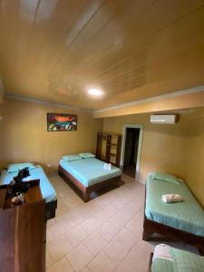Postelja oz. postelje v sobi nastanitve Hotel Ticozuma