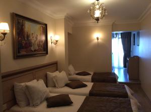 Postel nebo postele na pokoji v ubytování Sultan Palace Hotel