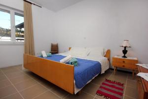 Postel nebo postele na pokoji v ubytování Apartments by the sea Podstrana, Split - 9412