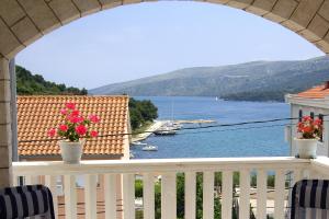 a balcony with a view of a body of water at Apartments by the sea Marina, Trogir - 10003 in Marina