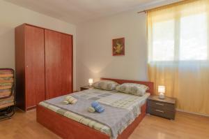 Postel nebo postele na pokoji v ubytování Apartments by the sea Cove Zaglav, Korcula - 9320