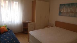 Postel nebo postele na pokoji v ubytování Apartment Dinjiska 9386a