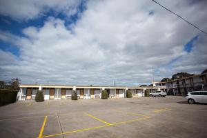 a parking lot in front of a building at Corio Bay Motel in Corio
