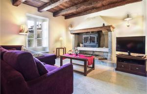 a living room with two couches and a fireplace at Beautiful Home In Loc, Spicciano With Outdoor Swimming Pool in Terenzano