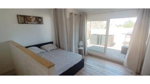 Posteľ alebo postele v izbe v ubytovaní Maison terrasse barbecue à 1 tram de Montpellier et 20 min des plages