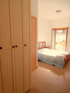 Posteľ alebo postele v izbe v ubytovaní B&B della Contrada Varenna