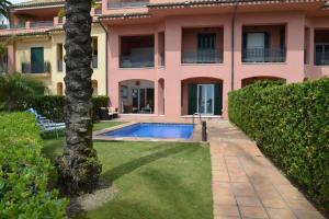 a house with a swimming pool in the yard at Lovely 2 bedroom unit with private pool in Sotogrande