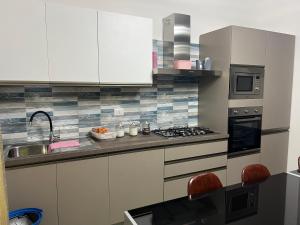 Kuchyň nebo kuchyňský kout v ubytování CASA VACANZE REFUGIUM & LOUNGE Ferienwohnung