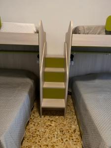 Postel nebo postele na pokoji v ubytování CASA VACANZE REFUGIUM & LOUNGE Ferienwohnung