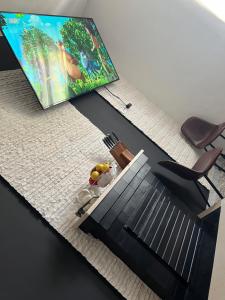 TV a/nebo společenská místnost v ubytování CASA VACANZE REFUGIUM & LOUNGE Ferienwohnung