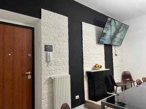 TV a/nebo společenská místnost v ubytování CASA VACANZE REFUGIUM & LOUNGE Ferienwohnung