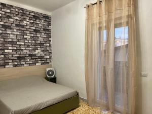 Postel nebo postele na pokoji v ubytování CASA VACANZE REFUGIUM & LOUNGE Ferienwohnung