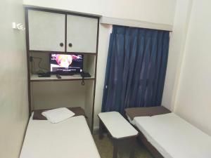 Hotel Kartiki客房内的一张或多张床位