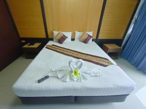 Postel nebo postele na pokoji v ubytování Suppamitr Villa Hotel