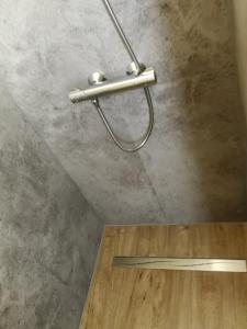 a metal towel rack on the ceiling of a room at Jennys Hofladen in Usedom Town