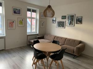 a living room with a couch and a table and chairs at Lovely 2-bedroom apartment in centre of Bratislava in Bratislava