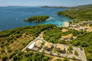 an aerial view of a house on a island in the water at 3Aktes Suites & Studios in Syvota