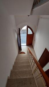 a staircase in a boat with a door and a window at Appartamento Da Castlin in Fano