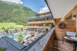a view from the balcony of a hotel with a pool at Hotel Weisses Lamm in See