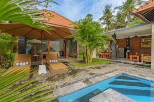 an image of a villa with a swimming pool at Coco Garden Pool Villas in Kubutambahan