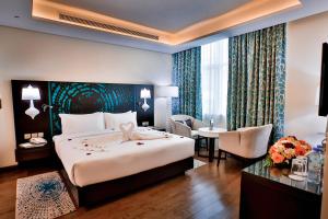 Postel nebo postele na pokoji v ubytování Signature Hotel Al Barsha