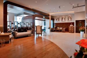 Postel nebo postele na pokoji v ubytování Signature Hotel Al Barsha
