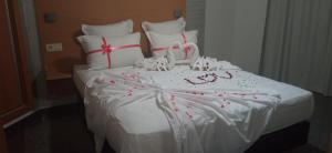 Postel nebo postele na pokoji v ubytování Hotel SunSet Beni Mellal