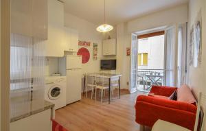 a living room with a kitchen and a dining room at Nice Apartment In Loano With Kitchenette in Loano