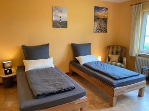 Postel nebo postele na pokoji v ubytování Haus Weidblick mit Weitblick