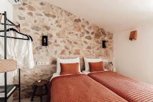 Postel nebo postele na pokoji v ubytování Ca la Vall - Your Mediterranean Stay + 29 fotografií