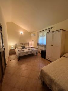 Letto o letti in una camera di Agriturismo Su Barraccu
