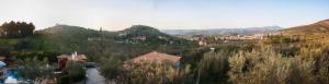 a view of a town with mountains and trees at Theofilos house in Nafplio
