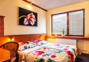 Postel nebo postele na pokoji v ubytování Hotel Áčko