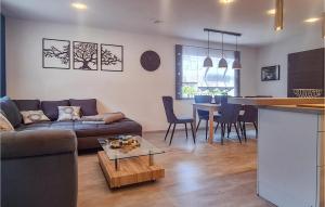 a living room with a couch and a table at Stunning Home In Neuhaus A,r, Ot Steinh With Kitchen in Steinheid