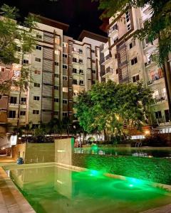a fountain in the middle of a city at night at Budget Friendly Studio Unit Staycation, Matina Enclaves Residences in Davao City