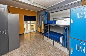 Ένα ή περισσότερα κρεβάτια σε δωμάτιο στο Marathon Hostel