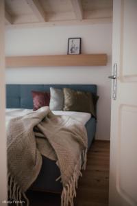 Кровать или кровати в номере Ferienwohnung Schauplats