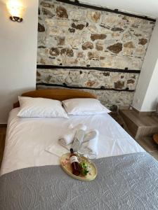 a plate of food on top of a bed at Elia & Meli Studio in Kallirakhi