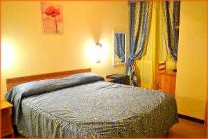 Postel nebo postele na pokoji v ubytování Hotel Anfora