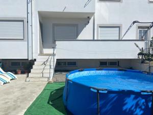 a swimming pool in a yard next to a house at Congidouro in Freixo de Espada à Cinta