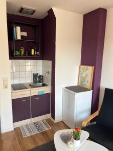 a small kitchen with a sink and a counter at Gemütliches Apartment in Essen in Essen