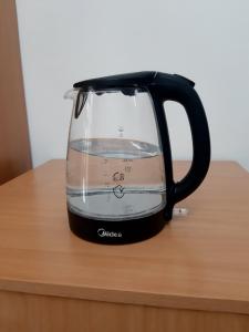 a black blender sitting on top of a table at Guest house Simiram in Cholpon-Ata