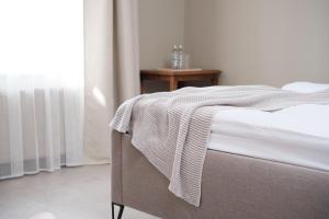 Postel nebo postele na pokoji v ubytování Hotel Pernigele