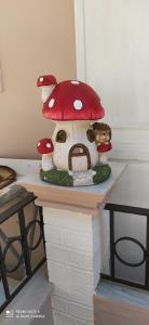 a mushroom figurine on a counter with a toy at spyridoula studio in Paleokastritsa