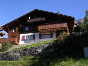 a house on the side of a hill at Chalet Eigersunne 2 in Wengen