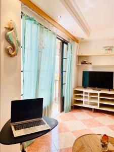 Televízia a/alebo spoločenská miestnosť v ubytovaní Casa Mariposa Corralejo Wi-fi Fibra