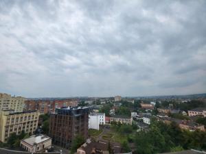 a city with buildings and a cloudy sky at PRESTIGE-GOLD in Rivne